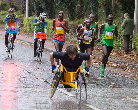 Leading bunch catching Paul Hannon, the first wheelchair athlete.